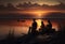 Three fishermen are standing on the shore of a reservoir with fishing rods and waiting for a bite, silhouettes are