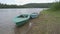 Three fishing traditional Russian boats moored on the bank of the Vishera river