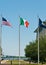 Three flagpoles and flags