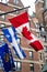 Three flags outside of entrance into Fairmont Hotel in Quebec City