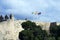 Three flags: Spain, Andolusia and Malaga on the defensive wall of the fortress. Arab fortress Gibralfaro Spanish. Castillo de Jib