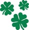 Three flying shamrocks with four leaves