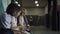 Three focused students sitting with tablet in school hall. Preteen communication