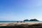 Three folding beach chairs on the beach with sea and bright sky in the background at Koh Mak in Trat, Thailand. Seasonal Vacation