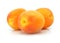 Three fresh apricot fruits isolated