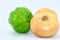 Three fresh and healthy products on a white background: green pepper and two bulbs