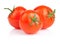 Three fresh juicy tomato with water droplets