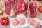 Three Fresh Raw Beef Meat on Craft Paper Steak Gray Background Ripe Red Pepper Chicken Cutlets Top View Horizontal