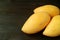 Three Fresh Ripe Mango Whole Fruits Isolated on Black Background