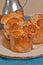 three, freshly baked, homemade, honey pecan monkey bread in paper forms