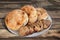 Three Freshly Baked Pitta Bread Loaves And Baguette Bread Slices On Porcelain Plate Set On Old Cracked Flaky Picnic Table