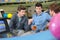 Three friends in bowling alley chatting