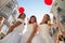 Three friends dressed as brides