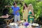 Three friends having a barbecue lunch