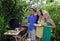 Three friends having a barbecue lunch