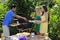 Three friends having a barbecue lunch