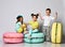 Three friends of triplets - two girls and a boy in bright clothes have fun at the birthday party fun room decoration macarons