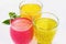 Three fruit drinks in pastel colors with basil seed