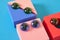 three funny friendly faces with eyes from the children's game constructor on a blue background copy space