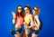 Three Funny Hipster Girls on Blue Background