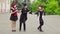 Three funny mimes act in the city street