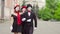 Three funny mimes play scenes in the city street