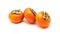 Three Fuyu persimmon isolated