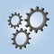 Three gears on a blue gradient background