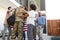 Three generation African American  family welcoming millennial male soldier returning home,low angle view