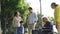 Three generation asian family enjoying outdoor activity in park