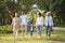 Three generation asian family walking in park