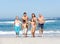 Three Generation Family On Holiday On Beach
