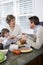 Three generation family in kitchen eating lunch