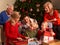 Three Generation Family Opening Christmas Gifts