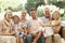 Three Generation Family Sitting On Sofa Together