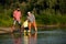 Three generation family. Skipping Stones with Dad adn Granddad. Three different generations ages: grandfather father and