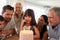 Three generation white family celebrating young girlï¿½s birthday with a cake and candles, close up