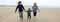 Three generations female running on the beach