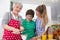 Three generations living together - happy family cooking together.