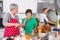 Three generations living together - happy family cooking together.