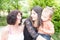 Three generations of women Beautiful granny, mother and daughter are hugging smiling