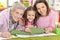 Three generations of women from one family lying on floor and dr