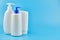 Three generic product tubes on blue background