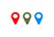 Three geo locate symbols on white background. Design element. Artificial green grass. Red and blue color. Empty space