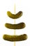 Three gherkins on a skewer, on a white background