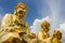 Three giant gold buddha statues. Shot at Wat Trimitr Vityaram Voravihahn, Bangkok, Thailand.