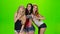 Three girl model pose for selfie photo. Green screen studio