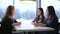 Three girlfriends talking in cafe in the winter