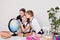 Three girls in the classroom studying geography globe of planet Earth