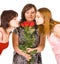 Three girls group smell roses